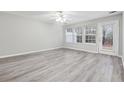 Spacious living room with gray walls and wood-look floors at 6235 Queen Meadow Se Dr, Mableton, GA 30126