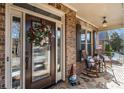 Inviting front porch with rocking chairs and a decorative wreath at 2082 Greenway Mill Ct, Snellville, GA 30078