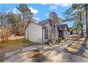 Side view of the house showcasing its light beige siding at 285 Independence Dr, Jonesboro, GA 30238