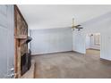 Spacious living room with neutral carpeting and a stone fireplace at 285 Independence Dr, Jonesboro, GA 30238