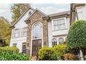 Front view of a charming two-story home with stone details at 3214 Burnette Ne Dr, Roswell, GA 30075