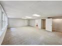 Spacious finished basement with neutral carpeting and large windows at 170 Pinehurst Dr, Stockbridge, GA 30281