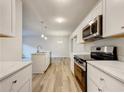 Renovated kitchen with island and stainless steel appliances at 170 Pinehurst Dr, Stockbridge, GA 30281