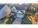 Open concept kitchen with island, hardwood floors, and white cabinets at 214 Walnut Ridge Rd, Canton, GA 30115