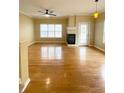 Bright living room featuring hardwood floors and a cozy fireplace at 4214 Quailbrook Ct, Tucker, GA 30084