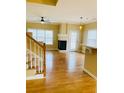 Hardwood floor living room with fireplace and view of kitchen at 4214 Quailbrook Ct, Tucker, GA 30084