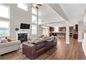 Bright and airy living room with a fireplace, high ceilings, wood floors and an open floor plan at 4259 Hansford Loop, Marietta, GA 30064