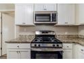 Gas range, microwave, and granite countertop at 3205 Harris Dr, Atlanta, GA 30344