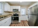 Updated kitchen with stainless steel appliances and granite countertops at 3388 Jackson Dr, Decatur, GA 30032