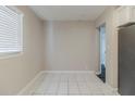 Bright dining area with tile floors and a view to the kitchen at 2446 Lynn Iris Dr, Decatur, GA 30032