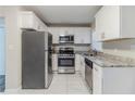 Renovated kitchen featuring stainless steel appliances and granite countertops at 2446 Lynn Iris Dr, Decatur, GA 30032