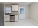 Updated kitchen with white cabinets, granite counters, and a view to the backyard at 2446 Lynn Iris Dr, Decatur, GA 30032