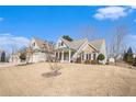 Two-story house with stone accents and three-car garage at 232 Baywood Ln, Villa Rica, GA 30180