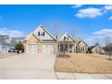 Two-story house with stone accents and three-car garage at 232 Baywood Ln, Villa Rica, GA 30180