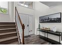 Bright entryway with stairs, hardwood floors, and a console table at 1484 Briaroaks Ne Trl, Atlanta, GA 30329