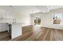 Open-concept kitchen and dining area with stainless steel appliances and sliding glass doors to the patio at 3601 Brycewood Dr, Decatur, GA 30034