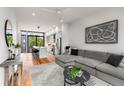 Open living area with sectional sofa and hardwood floors at 105 Georgia Se Ave # 2, Atlanta, GA 30312