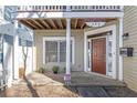 Front entrance with brown door and porch at 320 Harden Se St, Atlanta, GA 30312
