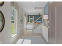 Bright entryway with hardwood floors and view to living room at 10 Camellia Dr, Fairburn, GA 30213