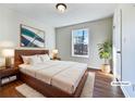 Bright bedroom with wood floors and large window at 114 Blake Cv, Douglasville, GA 30134