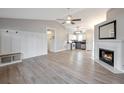 Open living room featuring a fireplace and hardwood floors at 526 Bluff Ct, Woodstock, GA 30188