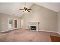 Living room with fireplace and access to back deck at 1834 River Rd, Mcdonough, GA 30252