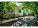 House side showing additional stonework and driveway access at 99 Moreland Se Ave, Atlanta, GA 30316
