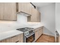 Modern kitchen with stainless steel appliances and light wood cabinets at 105 Georgia Se Ave # 4, Atlanta, GA 30312