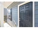 Black front door with a simple design, adding curb appeal to the home at 2137 Chadwick Road, Atlanta, GA 30331