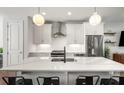 Modern white kitchen with stainless steel appliances and marble countertops at 1187 Rambler Cross, Atlanta, GA 30312