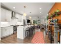 Open concept kitchen features white cabinets, an island, and stainless steel appliances at 1187 Rambler Cross, Atlanta, GA 30312