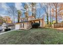 Two-story house with attached garage and landscaped yard at 2089 Glenwood Downs Dr, Decatur, GA 30035