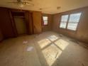 Empty bedroom with hardwood floors and ample natural light at 214 Pinewood Ln, Stockbridge, GA 30281