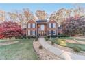 Brick house with two-story entry and manicured landscaping at 686 Newton Factory Bridge Rd, Covington, GA 30014