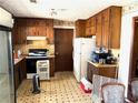 Kitchen with wood cabinets and appliances at 3174 Glen Hollow Dr, Rex, GA 30273