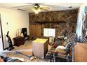 Living room with stone fireplace at 3174 Glen Hollow Dr, Rex, GA 30273