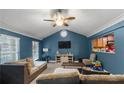 Spacious living room with vaulted ceiling, a neutral color palette, and plenty of natural light at 4955 R H Smith Blvd, Sugar Hill, GA 30518