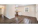 Open concept dining area with hardwood floors and kitchen access at 459 Oak Se Dr, Atlanta, GA 30354