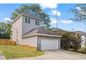 Detached garage with a driveway and a neatly landscaped yard at 1410 Metropolitan Sw Pkwy, Atlanta, GA 30310