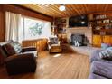 Spacious living room with wood paneling, fireplace, and hardwood floors at 363 Nebo Rd, Dallas, GA 30157