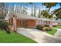 Attached carport with decorative accents at 719 Lynn Valley Sw Rd, Atlanta, GA 30311