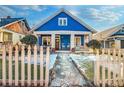 Charming blue house with white trim, stone pathway, and picket fence at 836 Dill Sw Ave, Atlanta, GA 30310