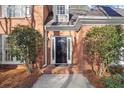 Inviting front entrance with black door and brick accents at 1772 Benningfield Dr, Marietta, GA 30064