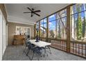 Spacious screened porch with patio furniture and wooded views at 1772 Benningfield Dr, Marietta, GA 30064