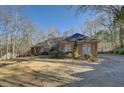 Ranch style brick home with a large driveway at 325 Yellowroot Ln, Sandy Springs, GA 30350