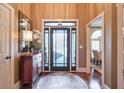 Bright and spacious entryway with hardwood floors and decorative accents at 531 Sweetfern Ln, Sugar Hill, GA 30518