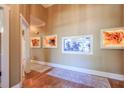 Elegant hallway featuring a built-in aquarium and hardwood floors at 531 Sweetfern Ln, Sugar Hill, GA 30518