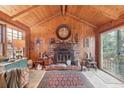 Wood paneled living room with brick fireplace at 610 Glenforest Rd, Sandy Springs, GA 30328