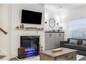 Living room with fireplace and built-in storage at 4197 Spring Valley Cir, Tucker, GA 30084