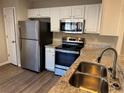 Modern kitchen featuring stainless steel appliances and granite countertops at 444 Kara Ln, Mcdonough, GA 30253